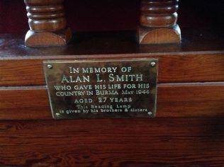 This brass memorial plate is placed on the pulpit | click to enlarge